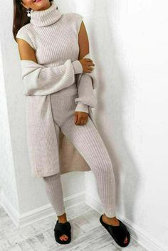 Stay cozy and fashionable in the LADIES 3 PIECE SUIT ROLL NECK CHUNKY KNITTED RIBBED TRACKSUIT LOUNGE SET Includes a roll neck, chunky knitted ribbed top and bottom matched with tracksuit trousers Perfect for lounging or running errands Stay cozy and fashionable in the LADIES 3 PIECE SUIT ROLL NECK CHUNKY KNITTED RIBBED TRACKSUIT LOUNGE SET. This stylish set includes a roll neck, chunky knitted ribbed top and bottom matched with tracksuit trousers. Perfect for lounging or running errands. Dimensions: One Size (8-14) Weight: 1.00 Colour: Stone Womens 3 Piece Suit, Colour Stone, Tracksuit Tops, 3 Piece Suits, Ribbed Top, Lounge Set, Lounge Sets, Roll Neck, Stay Cozy