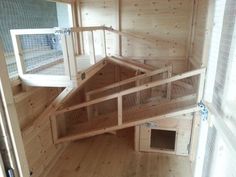 the inside of a chicken coop with wooden floors