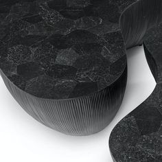 a black marble table with wavy lines on it