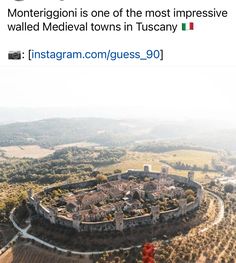 an aerial view of a castle surrounded by hills and trees with the caption instagram