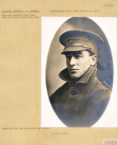 an old black and white photo of a man in uniform