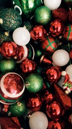 a pile of christmas ornaments sitting on top of each other