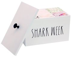 a white box with the word shark week written on it