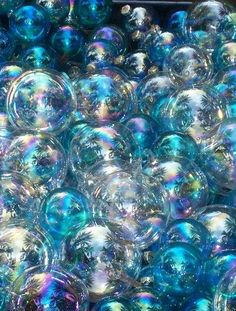 blue and silver balls are stacked on top of each other