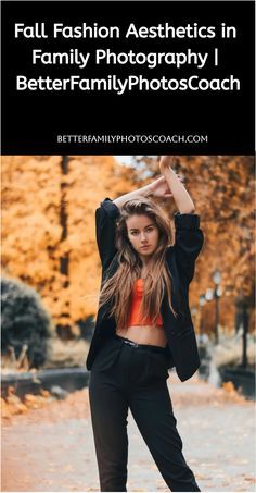 a woman is posing for the camera with her arms in the air