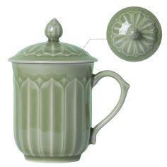 a green ceramic teapot with lid and handle