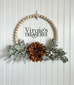 a wooden beaded wreath hanging on the front door