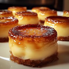 several small desserts on a white plate