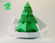 an origami christmas tree is displayed on a white surface with the text, paper format