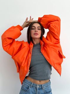 Step into cold weather with an oversized orange women bomber jacket. Long sleeves and water repellent fabric finish - which encourages water to bead off its surface.  Plush poly fill adds extra warmth - 100% Recycled Polyester. Suitable for temperatures +10 С/-1 C ( 50.℉/30.20℉) More jackets here: https://www.etsy.com/shop/ArtVyshyvankaUA?ref=seller-platform-mcnav§ion_id=39368873 🔷Model is 168cm/5'6" and wearing size S. --------------------------------------------------------------------------- Orange Jacket Outfit, Ladies Short Jackets, Orange Jacket, Oversized Jacket, Water Repellent Fabric, Crop Jacket, Jacket Outfits, Streetwear Fashion, Bomber Jacket