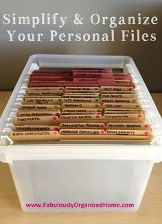 a plastic container filled with personal files on top of a table