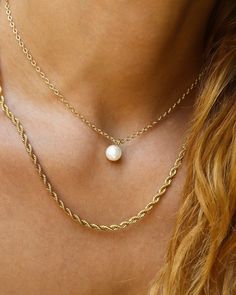 The Ariel pearl necklace is a simple pearl drop with gold filled accents. The Ariel necklace displays a delicate freshwater pearl, and can be worn in remembering that without grit, there is no pearl. Wear this necklace as a symbol of your dedication and hard work in getting to where you are today. Beautiful piece to wear individually or layered! Chain 24K Gold Filled Rolo Chain Length: 14” inches Pendant: 24K Gold Filled and Freshwater Pearl 8mm x 6mm Simple Pearl Pendant, Ariel Necklace, Necklace Displays, Layered Chain, Simple Pearl, Necklace Collection, Rolo Chain, Pearl Drop, Rope Chain