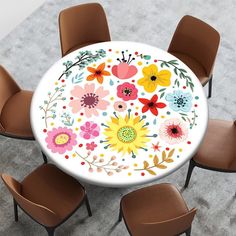 a white table with flowers painted on it