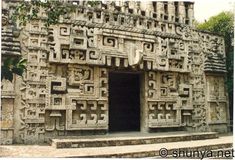 the entrance to an ancient building with carvings on it