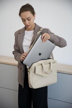 Introducing our women's leather laptop bag, the perfect blend of style and functionality. Designed specifically for women, this laptop tote bag is crafted from luxurious leather, allowing you to carry your laptop in utmost elegance.  Whether you're heading to the office or a business meeting, this leather laptop bag is a must-have accessory that combines practicality with timeless sophistication. Upgrade your professional look with our women's leather laptop bag today. Optionally, you can make c Luxury Briefcase For Business, Luxury Leather Briefcase For Gift, Elegant Daily Use Laptop Bag With Adjustable Strap, Classic Satchel Laptop Bag For Daily Use, Trendy Business Laptop Bag With Sleeve, Trendy Satchel Bag With Laptop Sleeve, Trendy Beige Satchel For Business, Trendy Beige Business Satchel, Trendy Large Capacity Briefcase For Travel