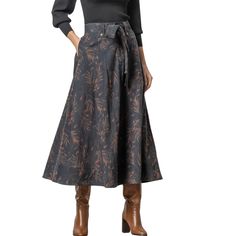 With a plain front and elastic at the back waist, this skirt is super flattering. High Waist Lined Skirt For Fall, Fall Pleated Skirt With Elastic Waistband, Relaxed Fit, Fall Wide Leg Lined Skirt Bottoms, Fall Wide Leg Lined Bottoms, Chic Flared Skirt For Fall, Chic Relaxed Fall Skirt, Elegant Fall Skirt With Elastic Waistband, Fall Long Pleated Skirt With Elastic Waistband, Fall Pleated Flared Skirt