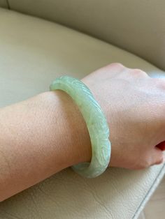 "🌈 Jade Bangle 58.6mm (2.31\"), Round Shape, Light Green 🌷 Untreated Natural Jadeite/ Grade A Jade 🌷 Certified : Yes 🌷 Jade from Myanmar/ Burma 🌷 Shape : Round 🌷 Inner diameter : 58.6mm / 2.31\" 🌷 Width & Thickness : 11.3 x 7.6mm 🌷 Color : Light Green 🌷 Free standard shipping from Hong Kong with tracking included 🌷 Take approximately 7-21 days to arrive worldwide ❤️ In Chinese Culture: Young people wear jade pendant will have a prosperous life, attracts good luck and friendship Old Elegant Carved Green Bangle, Elegant Green Carved Bangle, Carved Jade Round Bracelets, Carved Jade Bangle Bracelet, Carved Jade Bracelets, Carved Round Bracelets For Wedding, Carved Round Wedding Bracelets, Wedding Carved Round Bracelets, Carved Jade Bracelet