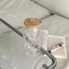 a glass table with a book and pen on it