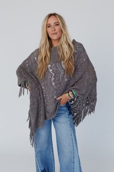 Get ready for the boho sweater of the season, the Sea Beyond Lace Poncho - it’s a true showstopper! This poncho is a must-have and a compliment magnet because it features: So pretty and unique, delicate, scalloped lace knit fabric Relaxed and loose poncho silhouette (no sleeves) So cute fringe details along the bottom edges for added boho style Lightweight layering piece to elevate any of your boho outfits! So pretty and flattering boho outfit pair with: Evermore Seamless Lace Racerback Bralette One Size Bohemian Sweater, Hippie Style Fall Poncho One Size, Bohemian Shawl Poncho For Fall, Bohemian Shawl Sweater For Fall, Oversized Open Knit Poncho For Fall, Oversized Fall Festival Poncho, Bohemian Shawl Sweater In Knit, Oversized Bohemian Sweater For Layering, Bohemian Knit Poncho For Spring