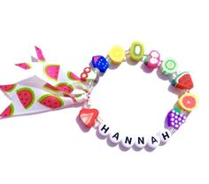 Hello everyone, welcome to my shop.This is a personalized/customized fruit stretch bracelet.Perfect for little girls as everyday jewelry.I will choose random fruits and ribbons to make your bracelet, I will always try to get as close as possible to original but stock may vary.I will need to know the name of your child (leave me a note at checkout section)and your child's wrist. (in inch- find your size in the menu)Can be made without the ribbon, leave me a note.Bracelet will come in an organza b Playful Green Stretch Bracelet As Gift, Sweet Personalized Adjustable Jewelry, Personalized Adjustable Sweet Style Jewelry, Sweet Adjustable Personalized Jewelry, Cute Personalized Multicolor Jewelry Gift, Playful Customized Name Bracelet For Birthday, Cute Multicolor Jewelry For Personalized Gifts, Personalized Sweet Bracelets As Gift, Sweet Personalized Bracelets As Gift