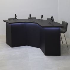 an empty conference table with chairs around it