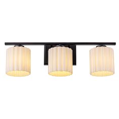 three light bathroom fixture with white shades on the top and black metal bars above it