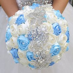 a bridal bouquet with blue and white roses