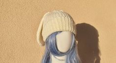 a wig with blue hair and a white hat