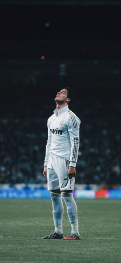 a man standing on top of a soccer field