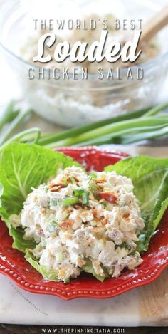 the world's best loaded chicken salad on a red plate with lettuce leaves