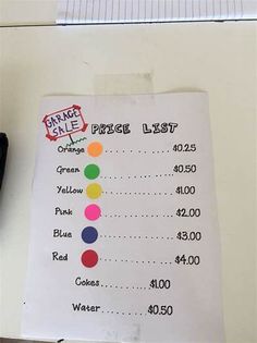 a price list on top of a desk next to a pen and calculator