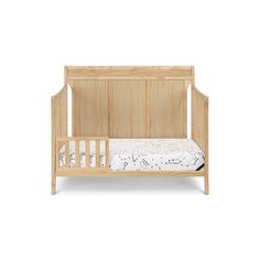 a small wooden crib with white sheets on the bottom and side rails, in front of a white background