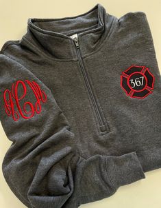 "This cute design is perfect to celebrate any firefighter and makes a perfect staple for your own wardrobe or as a gift!  All of our items are made on high quality products, not lower end pieces. We offer the design shown in the main listing photo on unisex quarter zip sweatshirts and four different types of full-zip jackets available in ladies cut and unisex sizing.  See below for comments on sizing.  To see all of our firefighter designs click here: https://www.etsy.com/shop/DoubleStitchDesign Funny Firefighter Shirts, Firefighter Shirt Ideas, Firehouse Decor, Embroidering Ideas, Women Firefighters, Firefighters Wife, Firefighter Wife Shirt, Firefighter Shirt, Firefighter Apparel