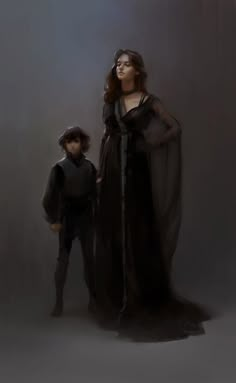 a woman in a black dress standing next to a young boy wearing a hat and cloak