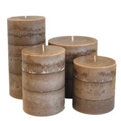 four brown candles sitting next to each other