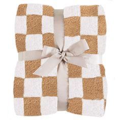 a brown and white checkered blanket with a bow