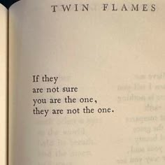 an open book with the words twin flames written in black ink on it's pages