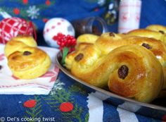 some bread rolls are sitting on a plate next to christmas decorations and other holiday items