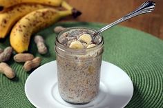 a glass jar filled with oatmeal sitting on top of a white plate