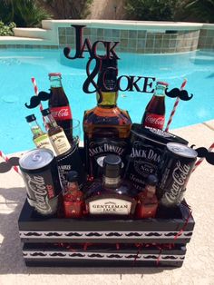 an outdoor pool party with liquor bottles and moustaches