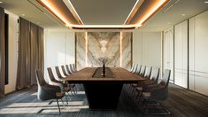 a long wooden table surrounded by chairs in a room with marble walls and flooring