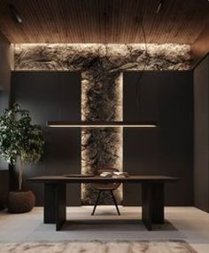 a modern dining room with black walls and wood flooring, along with a rug on the floor