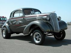 an old pickup truck parked in a parking lot