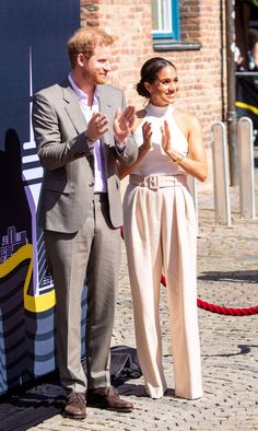 a man and woman standing next to each other