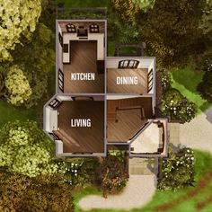 an aerial view of a house in the middle of a wooded area with trees and shrubs