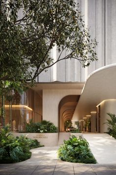 the entrance to an office building with trees and plants