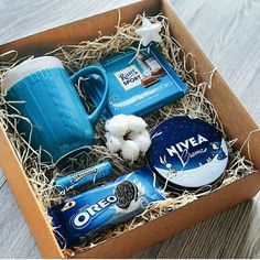 an open box with coffee, milk and other items