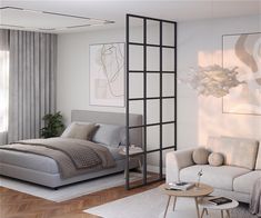 a modern bedroom with white walls and wood flooring