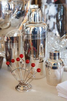 a table topped with silver and red items