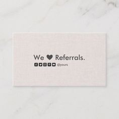 a white business card with the words we love referals